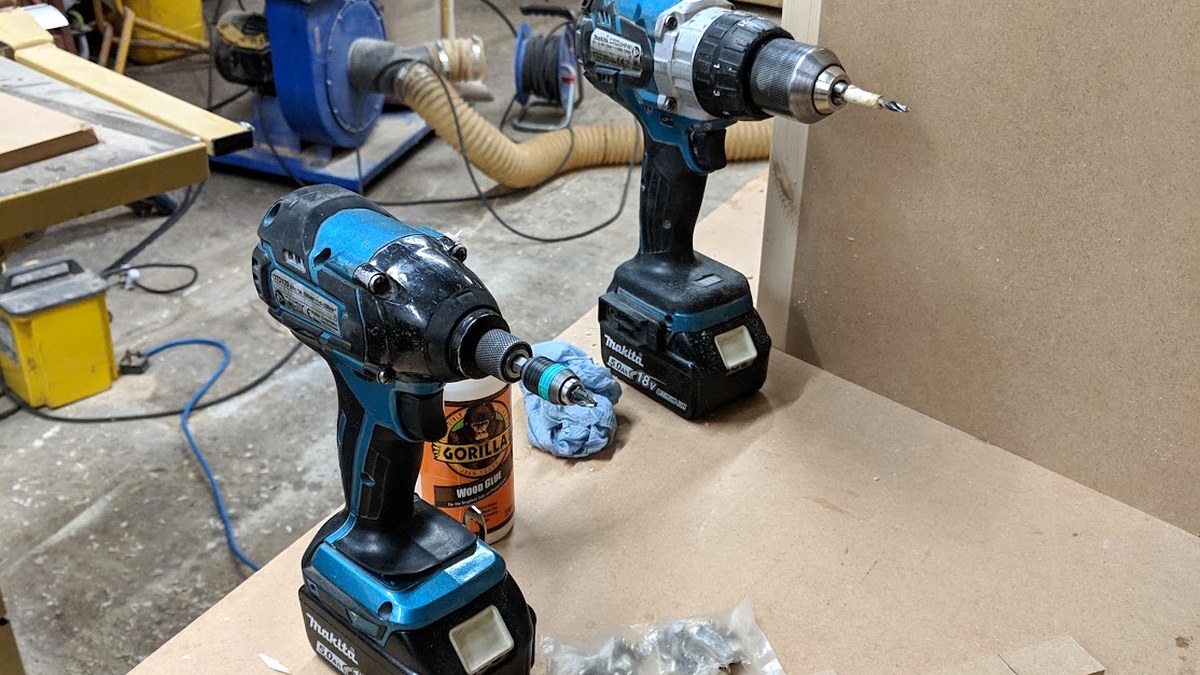 Cordless combi drill and impact driver on a workshop bench, no lead