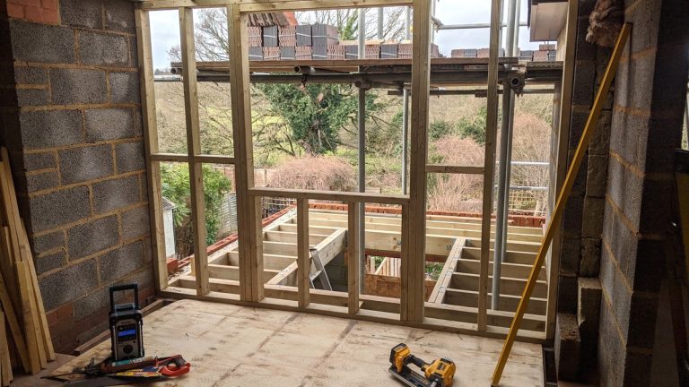 First fix carpentry: stud partition framing and floor joists with a first fix nailer