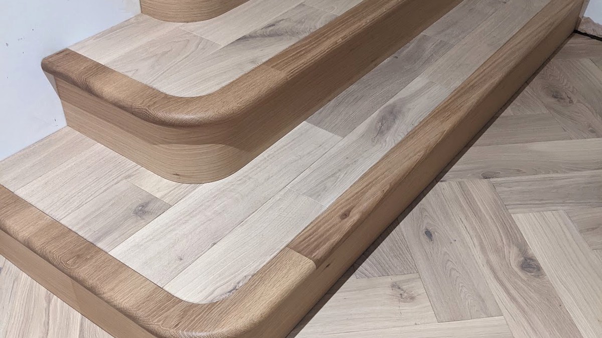Oak stair treads and balustrade, showing staircase work spanning first and second fix carpentry