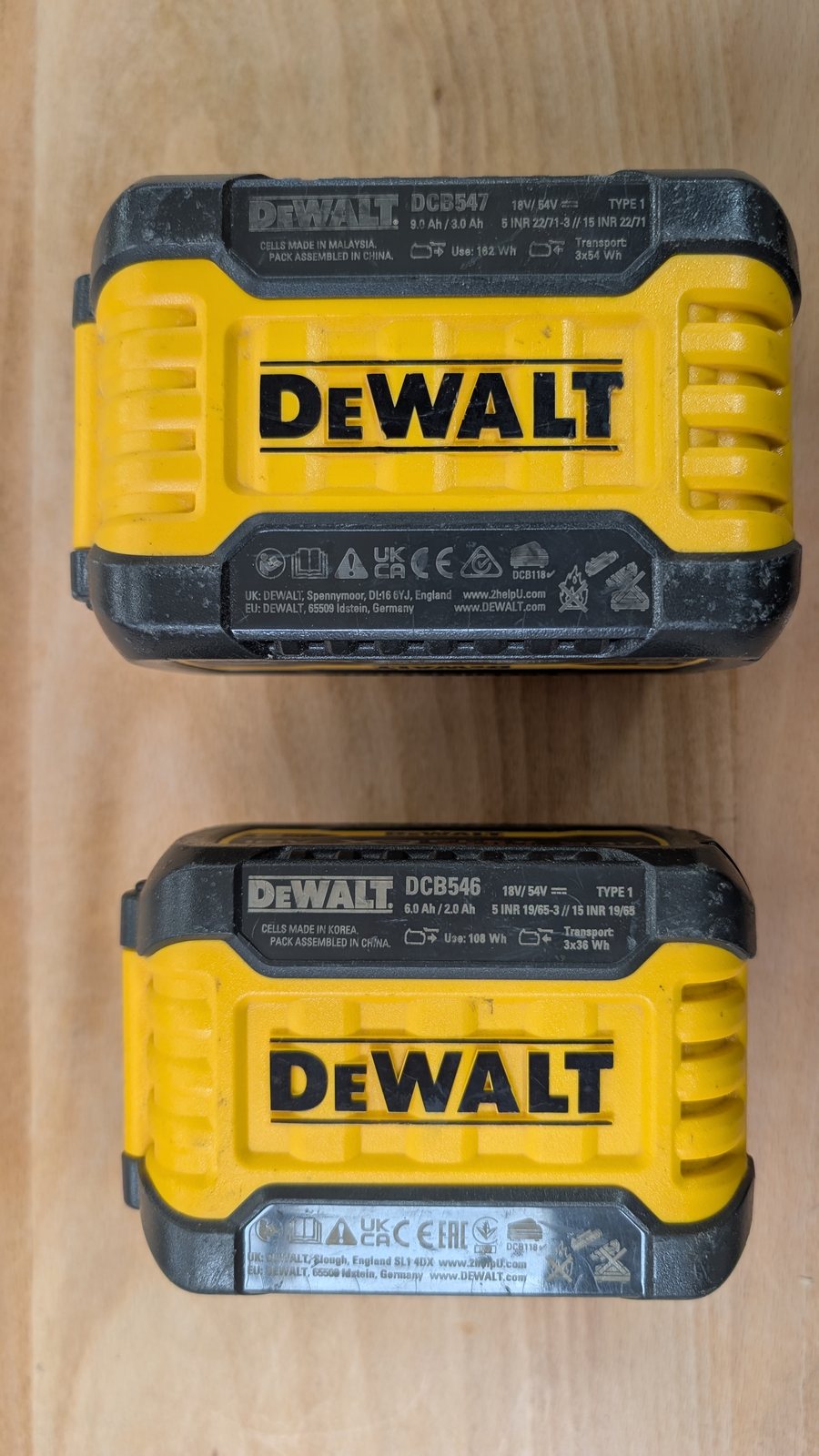 The spec labels on two DeWalt FlexVolt packs, reading 9.0 Ah / 3.0 Ah and 6.0 Ah / 2.0 Ah